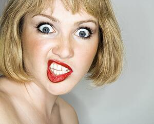 Blonde woman with angry expression