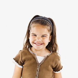 Cute little girl standing smiling