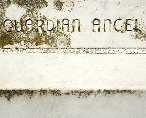 Gravestone with words 'Guardian Angel' on it