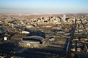 Aerial cityscape of urban Denver, Colorado, with Mile High stadium