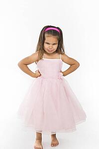 Girl wearing pink dress pouting
