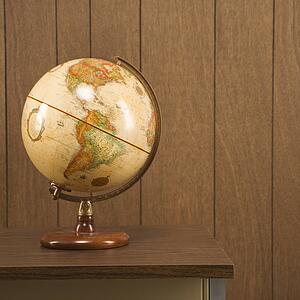Sill life shot of a vintage world globe sitting on a desk
