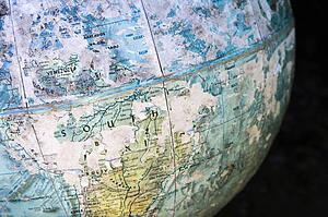 Old cracked and weathered globe focusing on South America