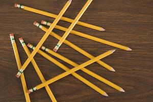 Aerial view of wooden pencils scattered on desktop