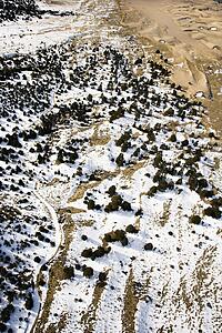 Aerial landscape of snowy plains in Great Sand Dunes National Park, Colorado