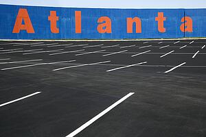 Empty parking lot with Atlanta painted on wall in Atlanta, Georgia