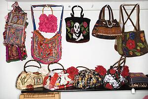 Unique handbags hanging in retail store.