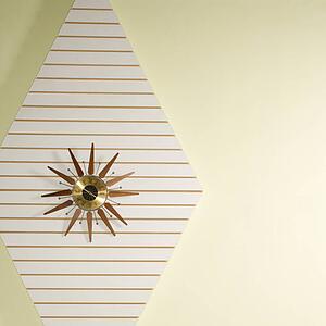 Retro star-shaped clock hanging on wall