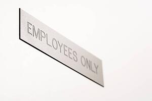 Selective focus of employees only sign