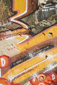 Concrete wall covered with graffiti