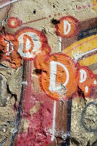 Concrete wall covered with graffiti