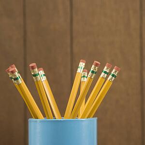 Close-up of a cup filled with wooden pencils