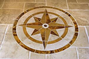 Marble floor with star shape in affluent home.
