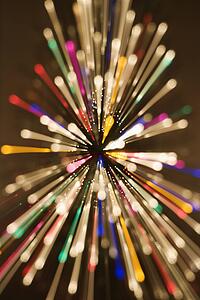 Motion blurred multicolored lights in radial starburst pattern