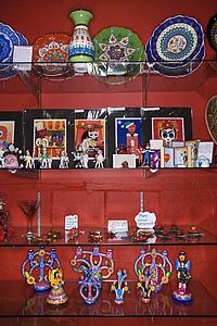 Shelves of unique folk art in retail store