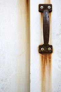 Detail of rusted door handle