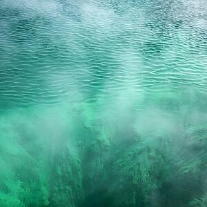 Pool of steaming turquoise water