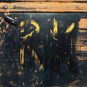 Close-up of scratched up door on old pick-up truck