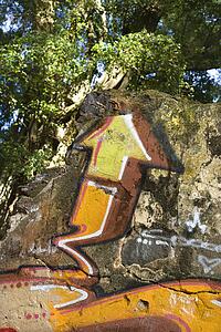 Concrete wall covered with graffiti