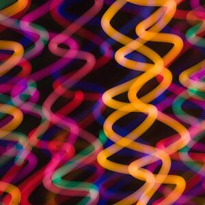 Multicolored lights forming abstract squiggle pattern from motion blur