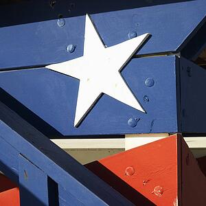 Close-up of white star on a wooden structure