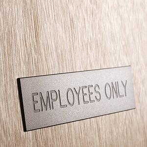 Employees only sign on wooden door