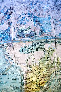 Old weathered globe focusing on South America
