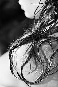 Close up of long hair resting on woman's shoulder