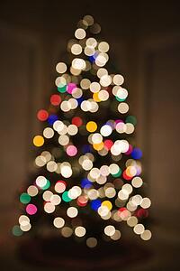 Abstract Christmas tree with blurred multicolored lights.