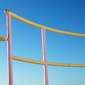 Pink and yellow painted railings of lifeguard