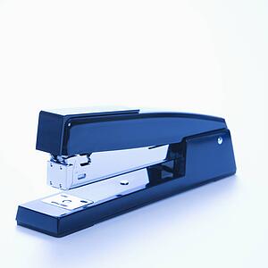 Blue stapler on white background