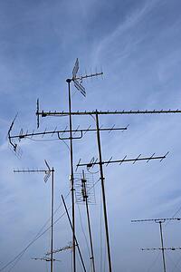 Antennas against blue sky