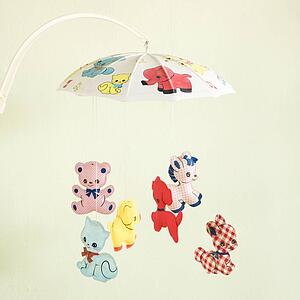 Still life of vintage baby mobile with colorful moving animals