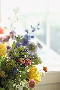 Flower arrangement in front of window
