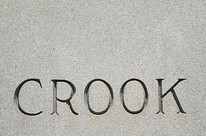 'Crook' carved in stone