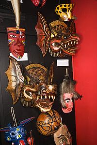 Folk art masks hanging in retail store