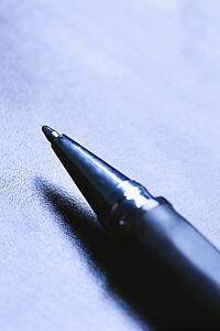 Blue tone close-up of pen tip