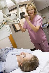 Nurse With Patient Having An X-Ray