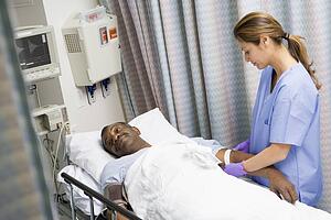 Nurse Caring For Patient