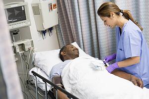 Nurse Caring For Patient