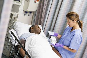 Nurse Caring For Patient