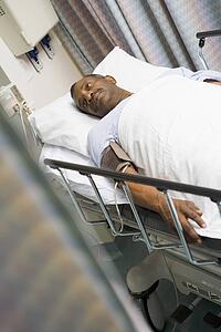 Patient In Hospital Bed 