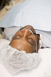 Patient Under Anaesthetic In Operating Theatre 