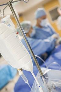 Surgeons Operating On Patient