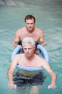 Instructor And Patient Undergoing Water Therapy