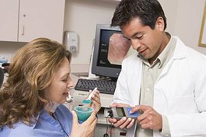 Doctor Performing Check-Up On Patient