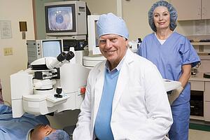 Doctor, Nurse And Patient About To Undergo Eye Exam