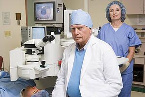 Doctor, Nurse And Patient About To Undergo Eye Exam