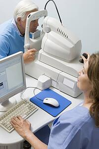 Nurse Checking Patient's Eyes