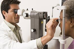 Doctor Checking Patient's Eyes
